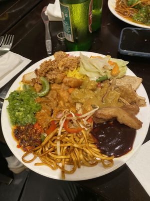 plate of hot food - ‘beef’, yellow ‘chicken’ curry, sweet + sour ‘chicken’, ‘chicken’ in black bean sauce, mixed veg noodles, special fried rice, mixed veg, crispy  at Su Vegan Buffet in West London
