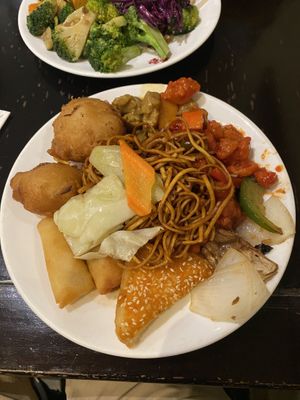 My food including vegetable tempura, mixed veg noodles, sesame toast, spring rolls, sweet-and-sour chicken  at Su Vegan Buffet in West London