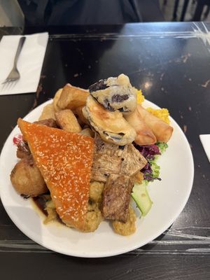 Plate of assorted vegan buffet food   at Su Vegan Buffet in West London