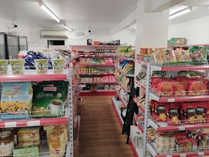 Non-vegan (check for e.g. dairy in ingredients) Asian shop at the rear of the restaurant at Su Vegan Buffet in West London