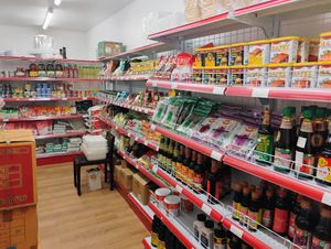 Non-vegan (check for e.g. dairy in ingredients) Asian shop at the rear of the restaurant at Su Vegan Buffet in West London