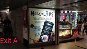 Stall is right next to escalator of Exit A at Jollibean - Raffles Place in Central Singapore