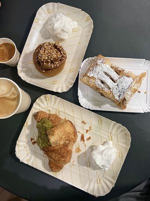 Partendo dall’alto e in senso orario: donuts alla nocciola accompagnato da panna montata, strudel di mele e cornetto al pistacchio salato accompagnato da panna montata  at Zia Esterina in Garbagnate Milanese