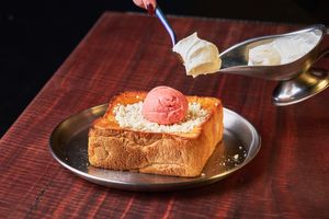 Our take on the viral honey toast - made with maple and topped with strawberry & gochujang sorbet + vegan white chocolate mousse. at Double Rainbow Bar & Eating House in Perth
