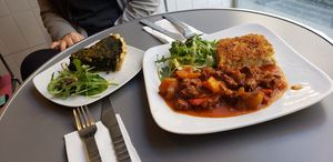 Spinach Tarte, seitan stew, and some cauliflower millet casserole at Aux Deux Portes in Geneva