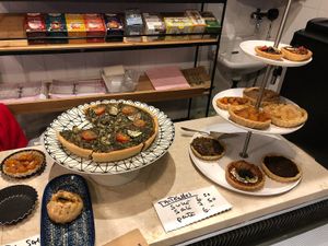 Selection of sweet and savory pastries at Aux Deux Portes in Geneva