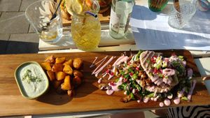 Main dish and elderflower on the rocks 😍 at Vegane Glorie in The Hague