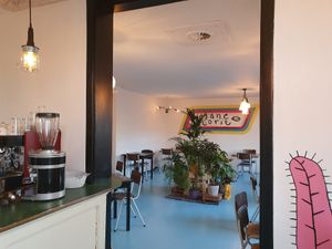 The plantbased restaurant with murals and handmade lamps at Vegane Glorie in The Hague