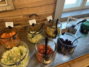Salad buffet: Carrots with tarragon, citrus marinated cabbage, pickled swede, grilled olives, pickled mushrooms, lettuce, tomatoes, pickled beet, pea purée  at Härmän Rati in Jaervenpaeae
