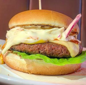 Vegan Dirty burger, Blackslaw with vegan Mayo, vegan hot sauce and vegan cheese on top of a Moving Mountains Patty. at Blacks Burgers in Epsom