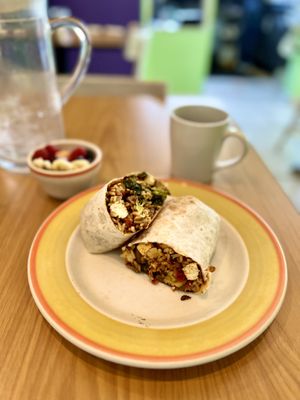 Curry wrap with a side of mixed fruit.   at Lucy's Cafe in Chicago