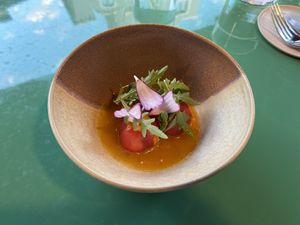 Tomatoes simmered in orange and oil base.  at KLE in Zurich