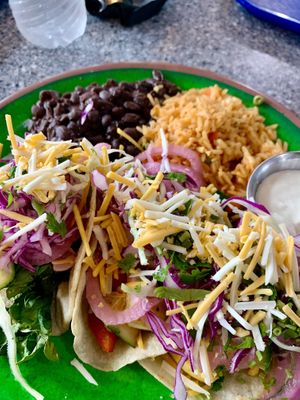 There are three tacos under there! 😍 Vegan squash tacos on the yellow corn tortillas, with pickles onion/cilantro/vegan cheese shreds.  Also featuring the homemade vegan crema!  at Migrants in Madison