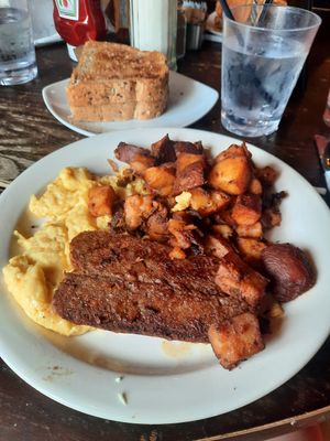 "The Alchemist": vegan eggs, vegan bacon, home fries, and two large pieces of multigrain toast at Toast Coffeehouse in Patchogue