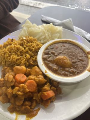 Chikn entree with rice, beans, and yuccaa  at The Earthy Kitchen in Orlando