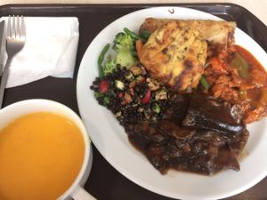 carrot-pumpking soup and a buffet plate at Loving Hut - Na Porici in Prague