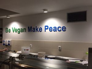 behind the counter at Loving Hut - Na Porici in Prague