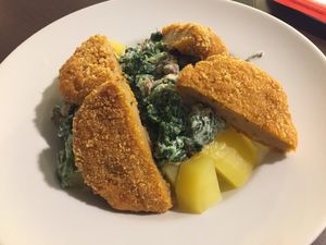 Schnitzel, creamy spinach and potatoes  at Loving Hut - Na Porici in Prague