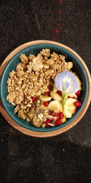 Fitness bowl, fruit salad and granola with a dash of Coconut Mylk at Coffee Ideas in Auroville