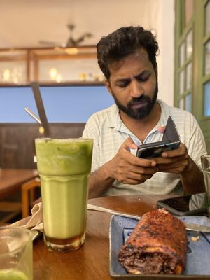 Sit by windows to get signal  at Coffee Ideas in Auroville