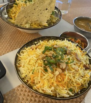 Saffron rice (~$3.60) and Hyderabad Mutton Briyani in the background   at Bazil Kitchen in Central Singapore