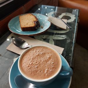 Hot chocolate with almond milk, vegan peanut cake at Sip and Wonder in Alicante