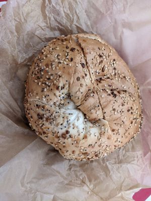 Everything bagel,toasted, with tofu, spinach, and artichoke spread at Liberty Bagels in New York City
