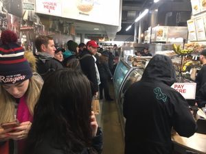 Inside shops, with long line at Liberty Bagels in New York City
