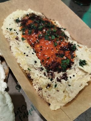 Hummus with muhammara and parsley. YUM!!! at Santo Falafel in Florence