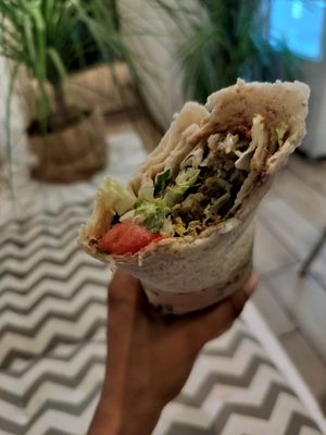 Falafel za'atar pita wrap (with tahini, mint, parsley, cucumber, tomatoes, and more). Soooo good at Santo Falafel in Florence
