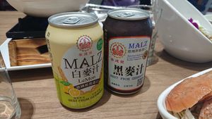 Left: 白麥汁 alc free malt beer with lemon lemonade, right: 黑麥汁 alc free black malt beer, NTD 30 each at Chóng Dé Fā Shū Shí 崇德發蔬食 in New Taipei City