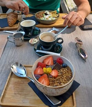 Acai bowl + bowl with kiwi and passionfruit + croissant at Kaffee Kamiel in Bruges