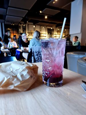 Homemade lemonade of red fruits with bag with bread at Kaffee Kamiel in Bruges