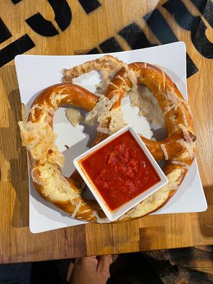 Giant Vegan Pretzel w/vegan cheese and marinara sauce. This was literally to big to fit on the plate. Made fresh, came out nice and hot. Just delicious.   at Barrel District in Cathedral City