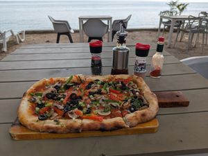 Veggie pizza without cheese at La Casa Tropicana by Cospace in Koh Phangan