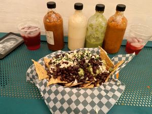 Nachos (15.000 COP) with beans, guacamole, onion, tomatoes and some kind of vegan cheese at Taco Veg in Medellin