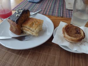 Carrot cake, a yoghurt dessert, and a vegan nata - all super yummy! at Granos Espaço Vegetariano in Lisbon