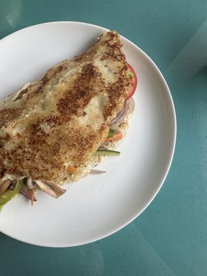 Cachapa with sautéed veggies, mushrooms and avocado   at Bienmesabe in Sucre