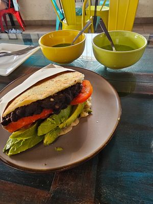 Delicious vegan arepa with black beans tomato and avocado, really cheap and filling at Bienmesabe in Sucre