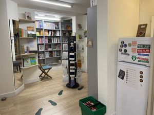 Books and fridge with vegan foods, like Watson’s cheese  at VEGA-LIFE in Amsterdam