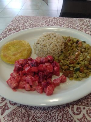 Yuca patty, beet salad, rice, lentil mixture at Prana Veggie in Quito