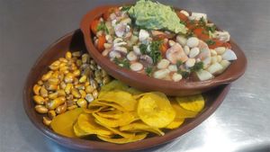 ECUADORIAN CEVICHE
Contains lupins beans, mushrooms, cherry tomatoes, avocado, sweet corn and served with green banana chips and toasted corn at Prana Veggie in Quito