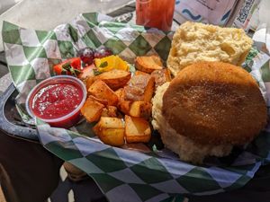 Chicken biscuit with home fries and fruit at The Panacea Restaurant in Wilmington