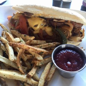 Beyond Sausage Hoagie with fermented fries and beet ketchup  at The Panacea Restaurant in Wilmington