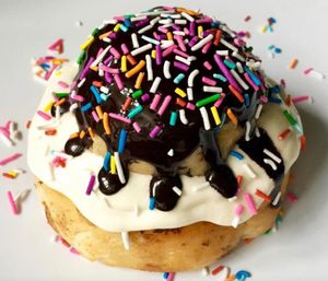 Cake Batter Frosting with Cookie Dough, Chocolate Sauce & Rainbow Sprinkles! at Cinnaholic in Schaumburg