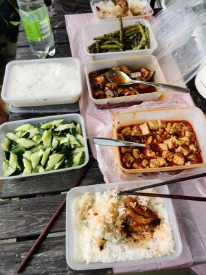 Green beans on top, eggplant in the middle and mapo tofu at the bottom. Cucumbers with garlic on the left. at Mei Lin in Helsinki