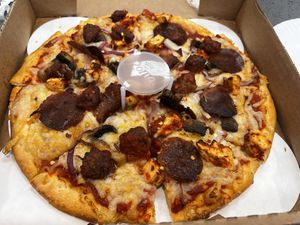 Vegan pizza! Pepperoni, meatballs, chicken, mushrooms and onions!  at Pizzeria Halt in Modesto