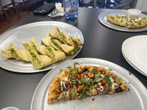 Tandoori pizza, pesto bread sticks, and chicken pesto pizza. All plant based.  at Pizzeria Halt in Modesto