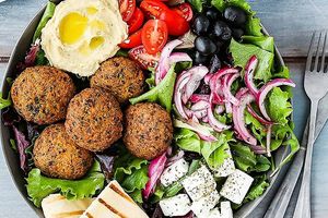 Little Traveler Salad (V)
Baked Falafel, garlic hummus, parsley, vegan feta cheese, red onions, hummus, sun dreid tomatoes, argula, mixed greens, black olives, balsamic dressing, n at Rejoice in Geneva