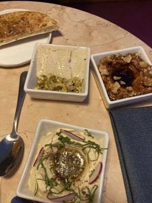 Cashew cheese, muhumarra, and hummus with pita   at Lulu Green in Boston